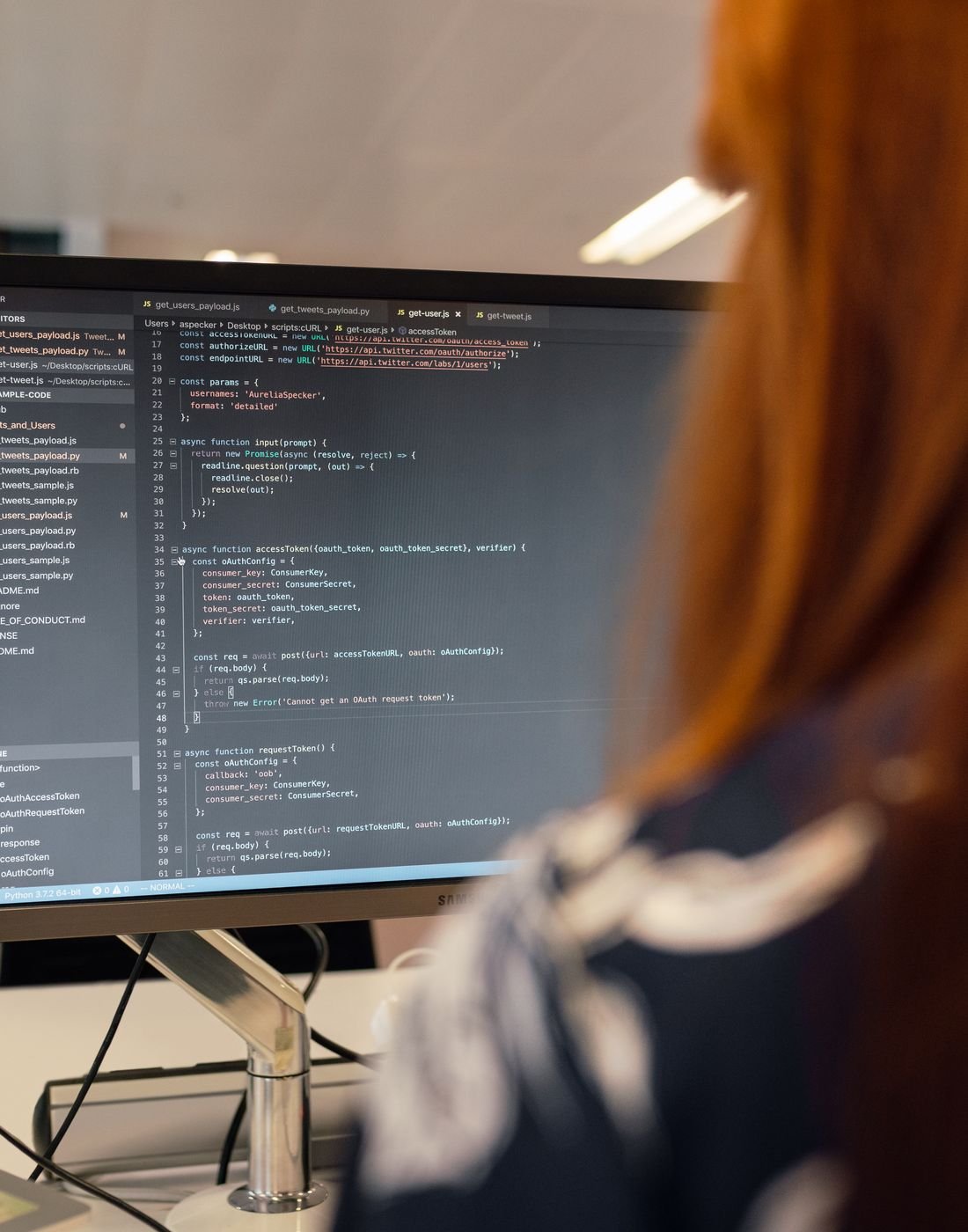 Software engineer reading code on a monitor while working through a track